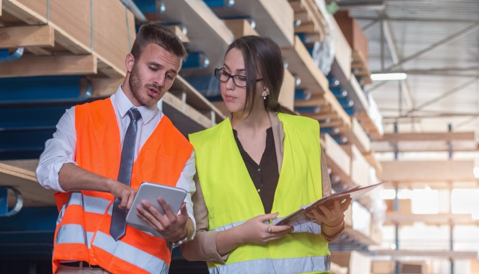 man and woman confering during an audit or inspection